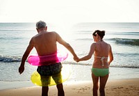 Senior friends enjoying the beach in the summertime