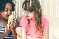 Little girls enjoying with ice cream