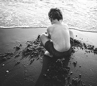 A little boy playing in the sand