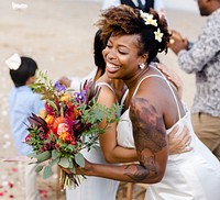 African American couple getting married at the beach