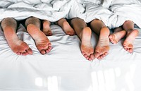 Whole family sharing a bed