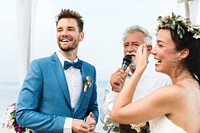 Young couple in a wedding ceremony at the beach