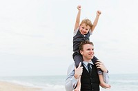 Cheerful family at beach wedding ceremony