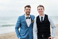 Groom and groomsman at the beach