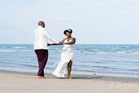 African American couple getting married at an island