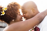 African American couple getting married at an island