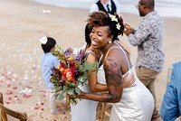 African American xouple getting married at the beach