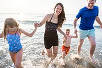 Family playing on the beach