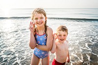 Siblings having fun on the beach