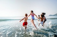 Kids running at the beach