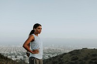 Woman stretching on a hill in LA