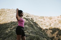 Woman stretching while on a hike