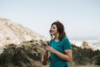 Woman drinking water while trekking