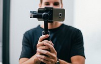 Man holding a gimbal with a phone