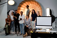 People posing for a photo in a studio