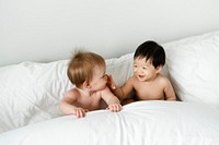 Cute babies on the bed
