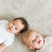 Cute babies lying on the carpet