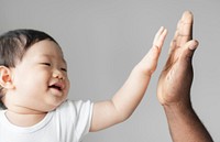 Baby giving a high five