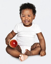 Baby sitting on the floor in a studio