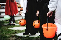Little children in Halloween costumes