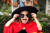 Young playful girl enjoying Halloween