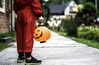 Little boy holding a Halloween lantern