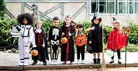 Diverse kids in Halloween costumes