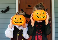 Little children trick or treating on Halloween