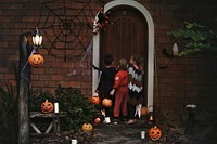 Little children trick or treating on Halloween