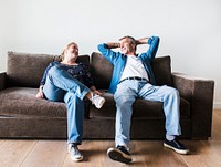 Couple sitting on a brown couch