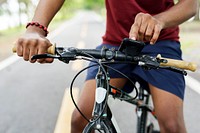 Finger pointing on a smartphone on a bike handle grips