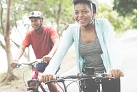 Cyclist couple riding together in a park