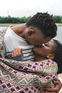 Cheerful couple kissing each other