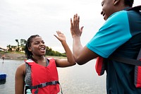 Couple doing a high five at the lake