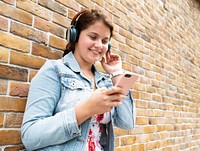 Teen girl listening to music through her headphones