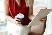 Businesswoman reading thew news from a digital tablet