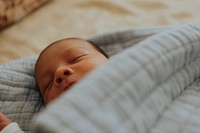 Infant baby fast asleep on the bed<br />