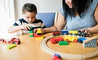 Mother and son playing together at a table