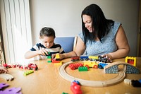 Mother and son playing together at a table