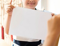 Little boy with a blank paper mockup