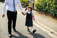 Father walking his daughter to school