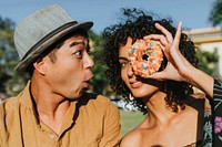 Friends having fun with a doughnut