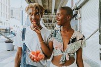 Couple snacking on fruit in the summer