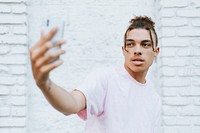 Man taking a selfie in downtown