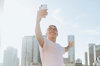 Man taking a selfie in downtown