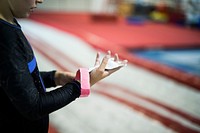 Young gymnast wearing a grip bar to her palm