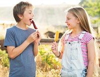 Kids eating ice popsicles