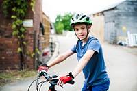 Young boy riding his bike