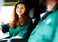 Paramedic woman driving an ambulance