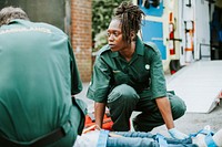 Paramedic team rescuing a young critical patient